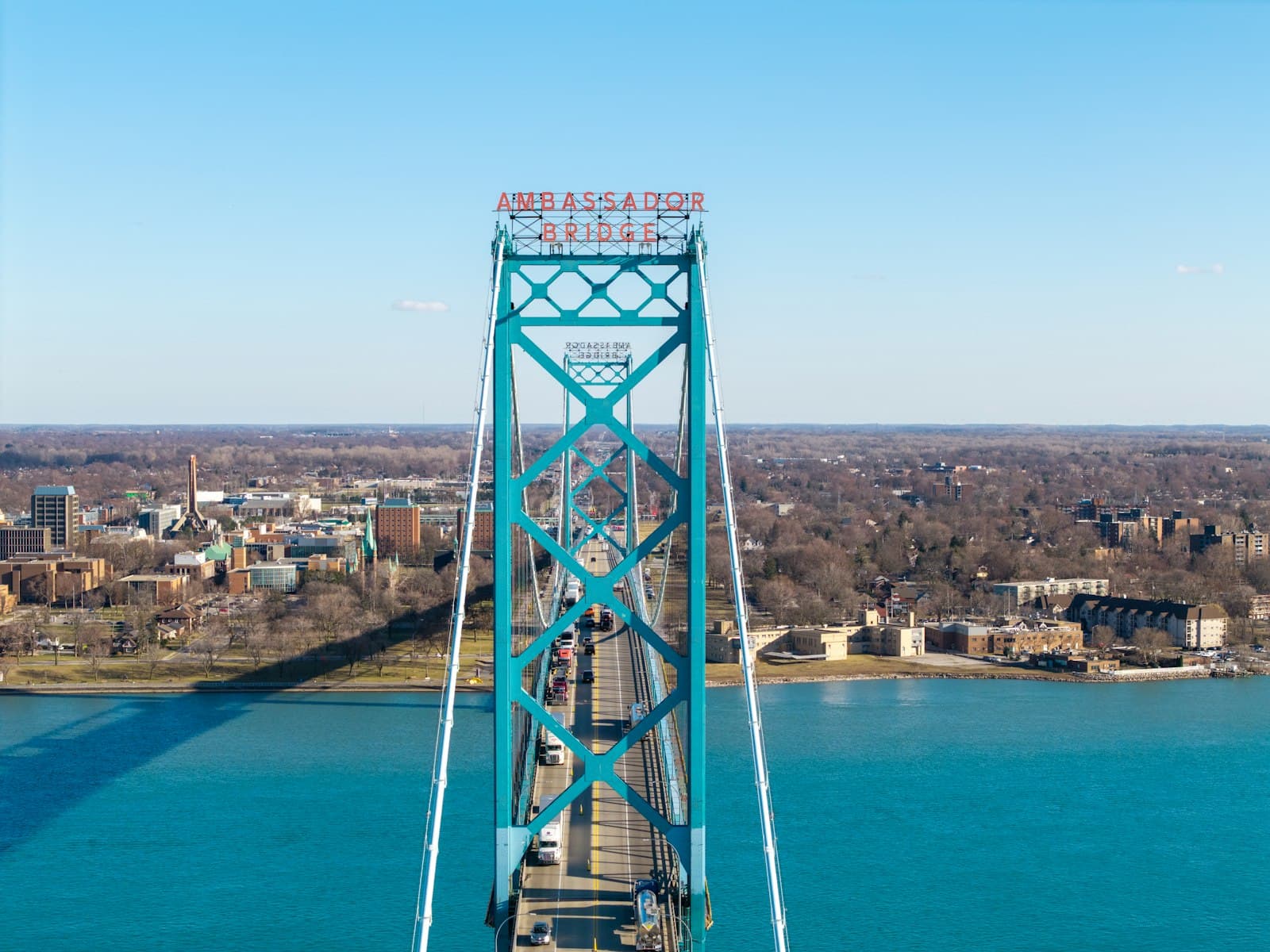 Tractor-trailers crossing the Ambassador Bridge over the Detroit River between Windsor and Detroit, where a good's country of origin now decides which US duties it pays